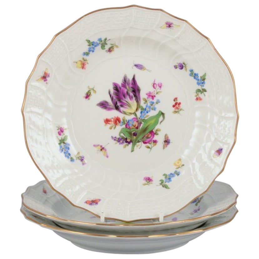 Meissen, Germany. Three plates in porcelain with flowers and butterflies For Sale