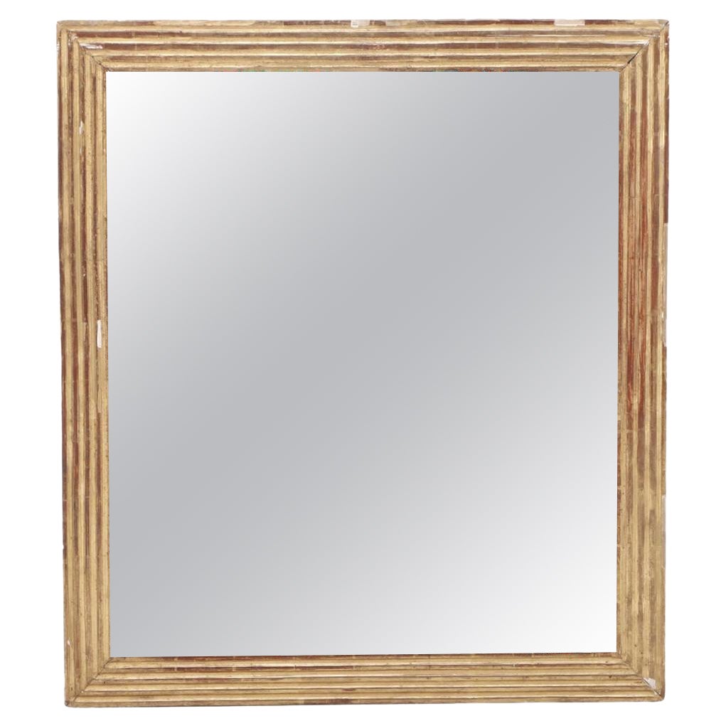 A square French Empire gilt wood mirror circa 1860. For Sale