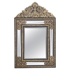 A continental brass repouse cushion mirror circa 1890.