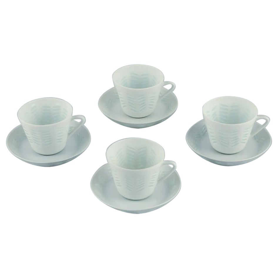Friedl Holzer-Kjellberg, Arabia. Four coffee cups and saucers in rice porcelain.
