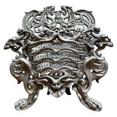 A Small  Ornate French Cast Iron Coal Grate 