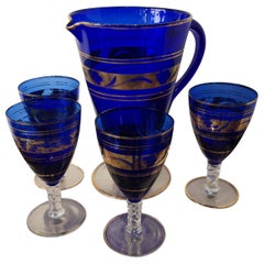 4 Cobalt blue and gold Murano glass tumblers and carafe, mid-19th century