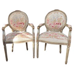 Used Pair of Louis XVI Style Painted Carved Wood and Needlepoint Fauteuils