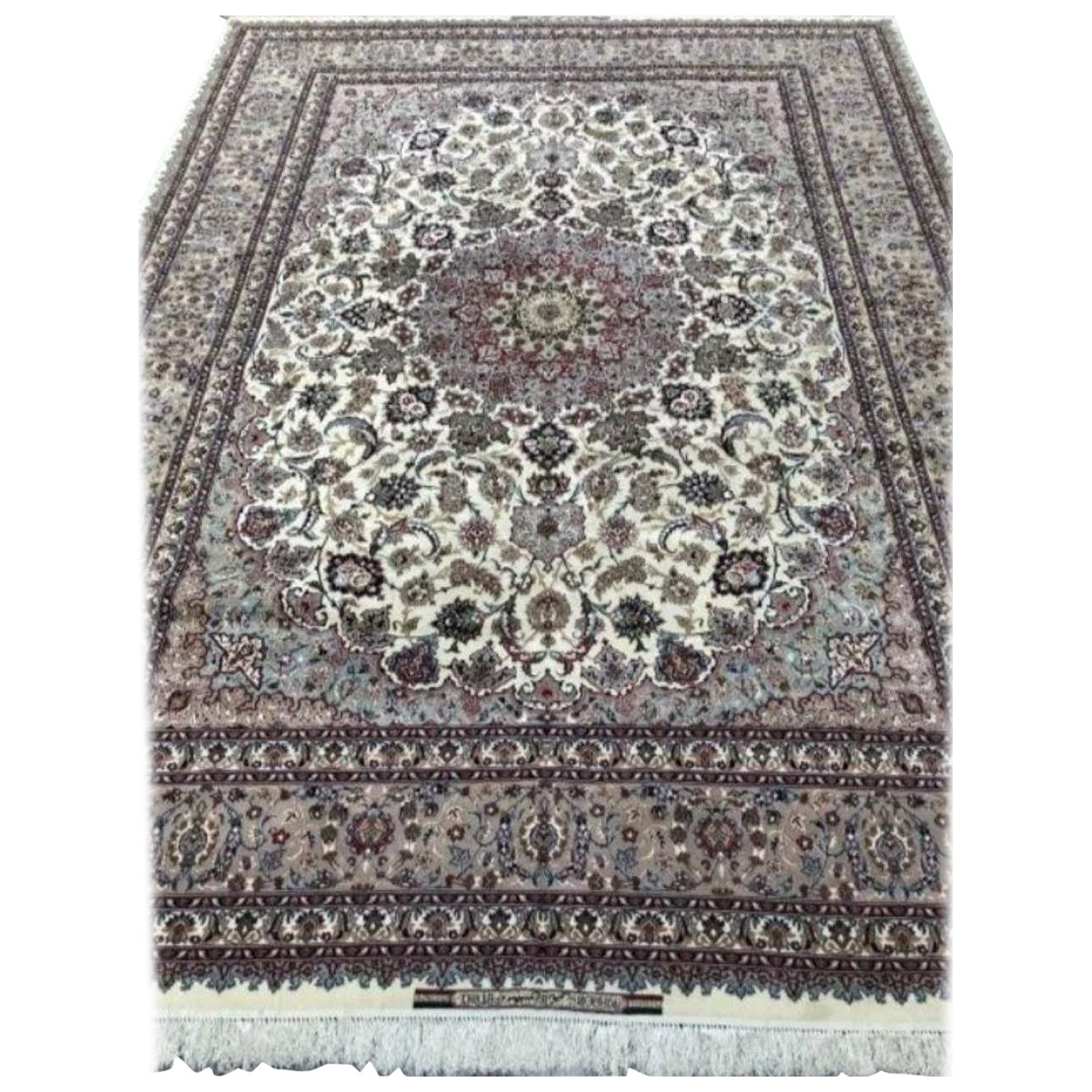 Magnificent Persian silk and wool pile with silk foundation. This rug has approximately 700 knots per sq inch with a total of 13,000,000 knots tied by hand one by one. It took 7 years to complete this beautiful piece of art. The signature reads:
