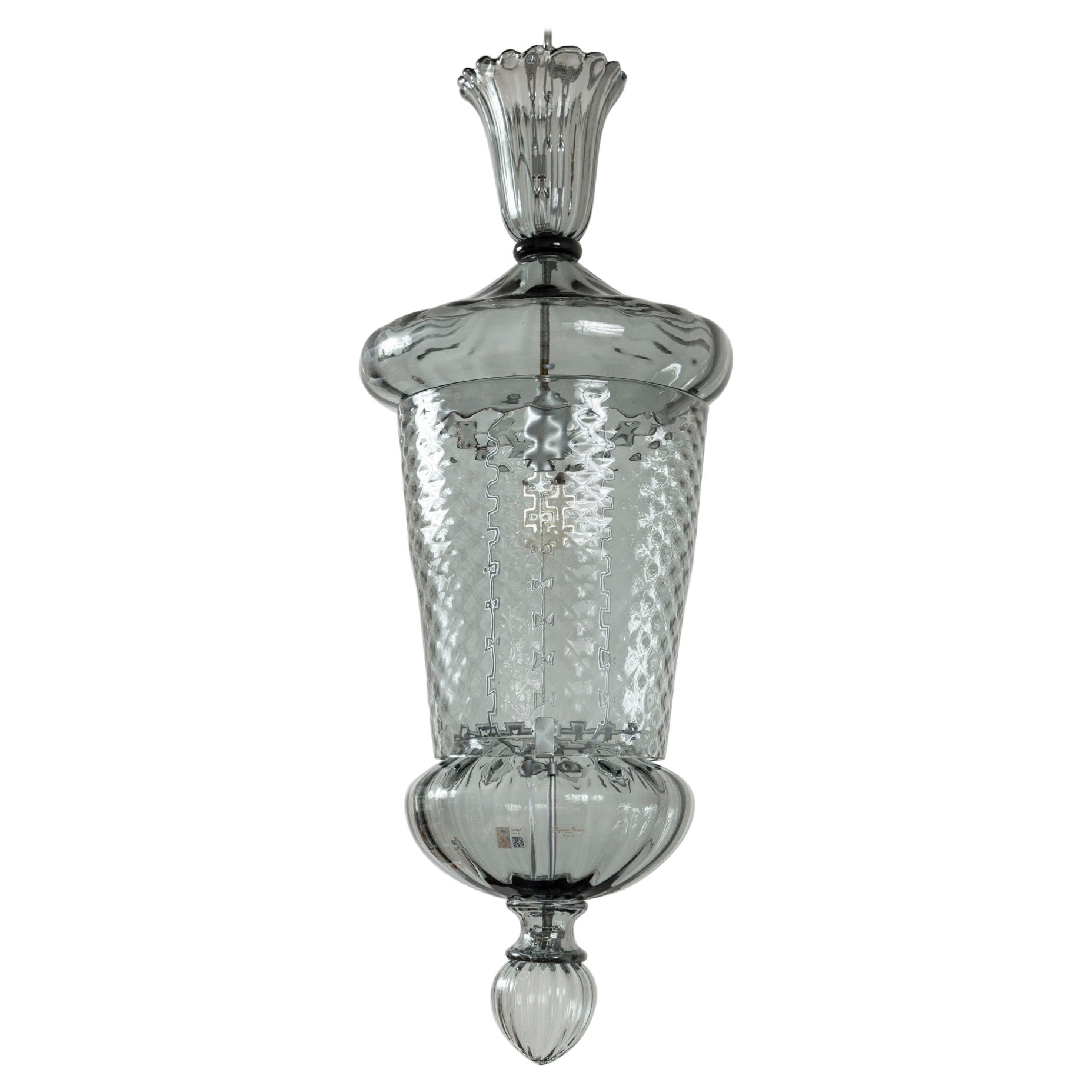 A very beautiful  large grey Venetian  lantern  composed of six seperately blown pieces.  Tapered cylindrical body blown in a textured diamond shaped/ baloton pattern.
Recently re wired for one E26 bulb, high wattage possible with use of dimmable