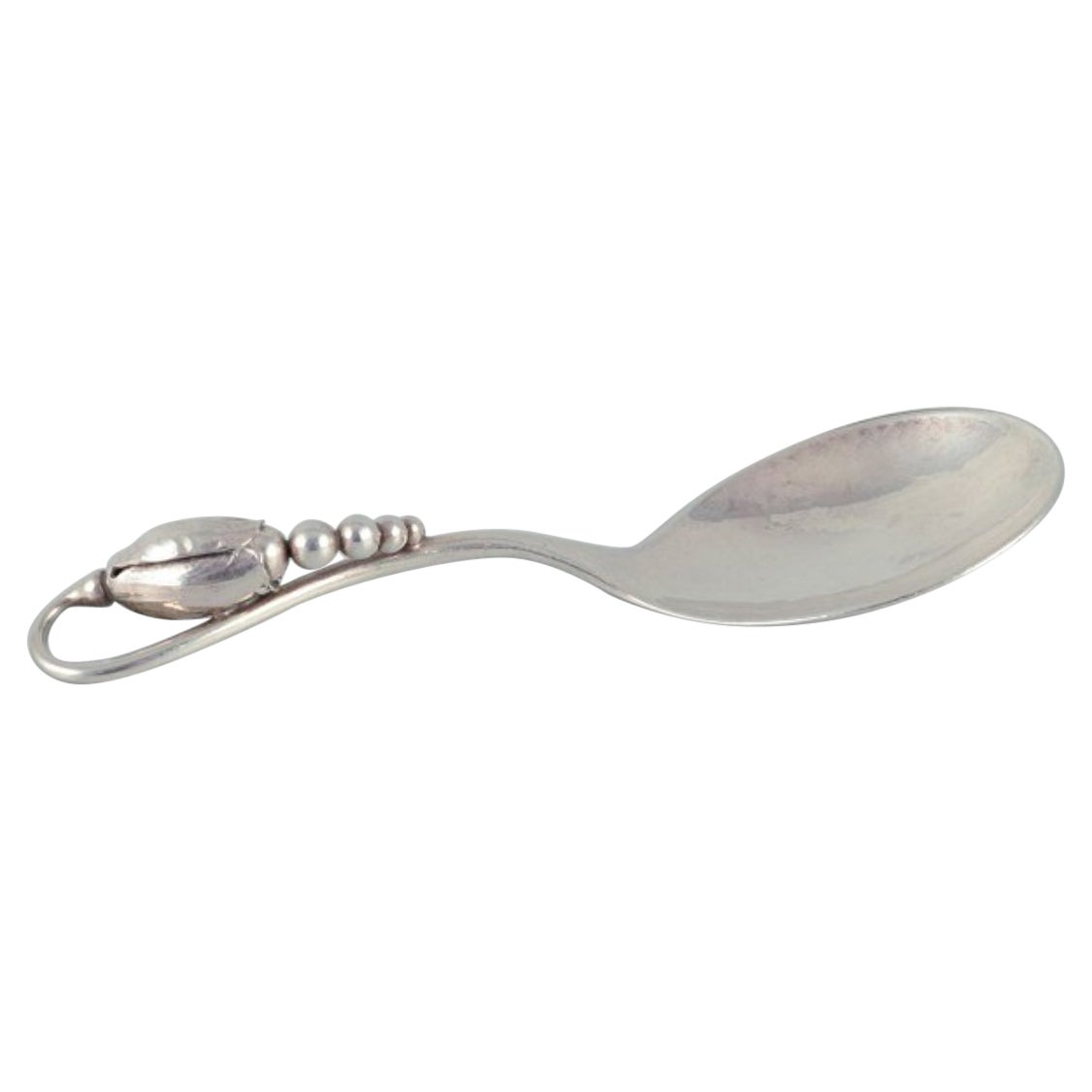 Georg Jensen, Denmark. "Blossom" sugar spoon in sterling silver.