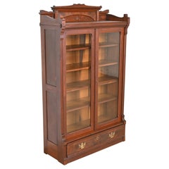 Herter Brothers Style Eastlake Victorian Carved Walnut and Burl Wood Bookcase