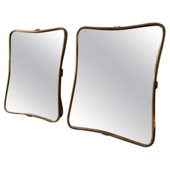 A pair of 1950s Gio Ponti Style Mid-Century Modern Brass Small Wall Mirrors
