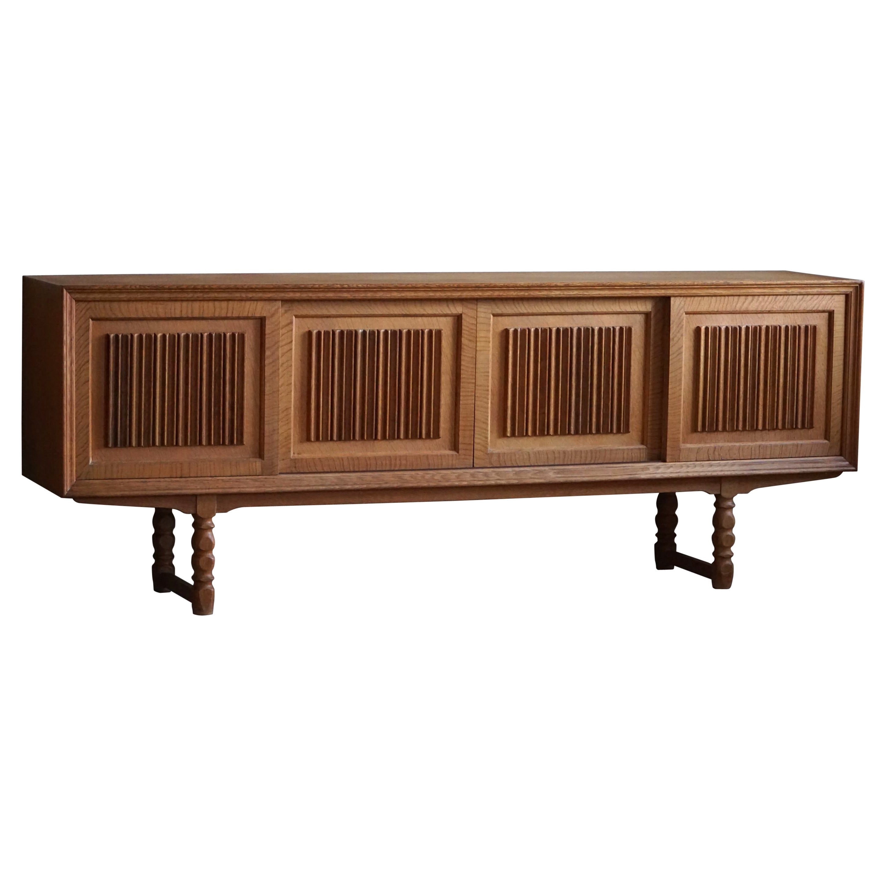 Mid Century Low Sculptural Sideboard in Oak, Made by a Danish Cabinetmaker, 1960 For Sale