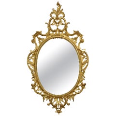 Carved gilt-wood oval wall mirror