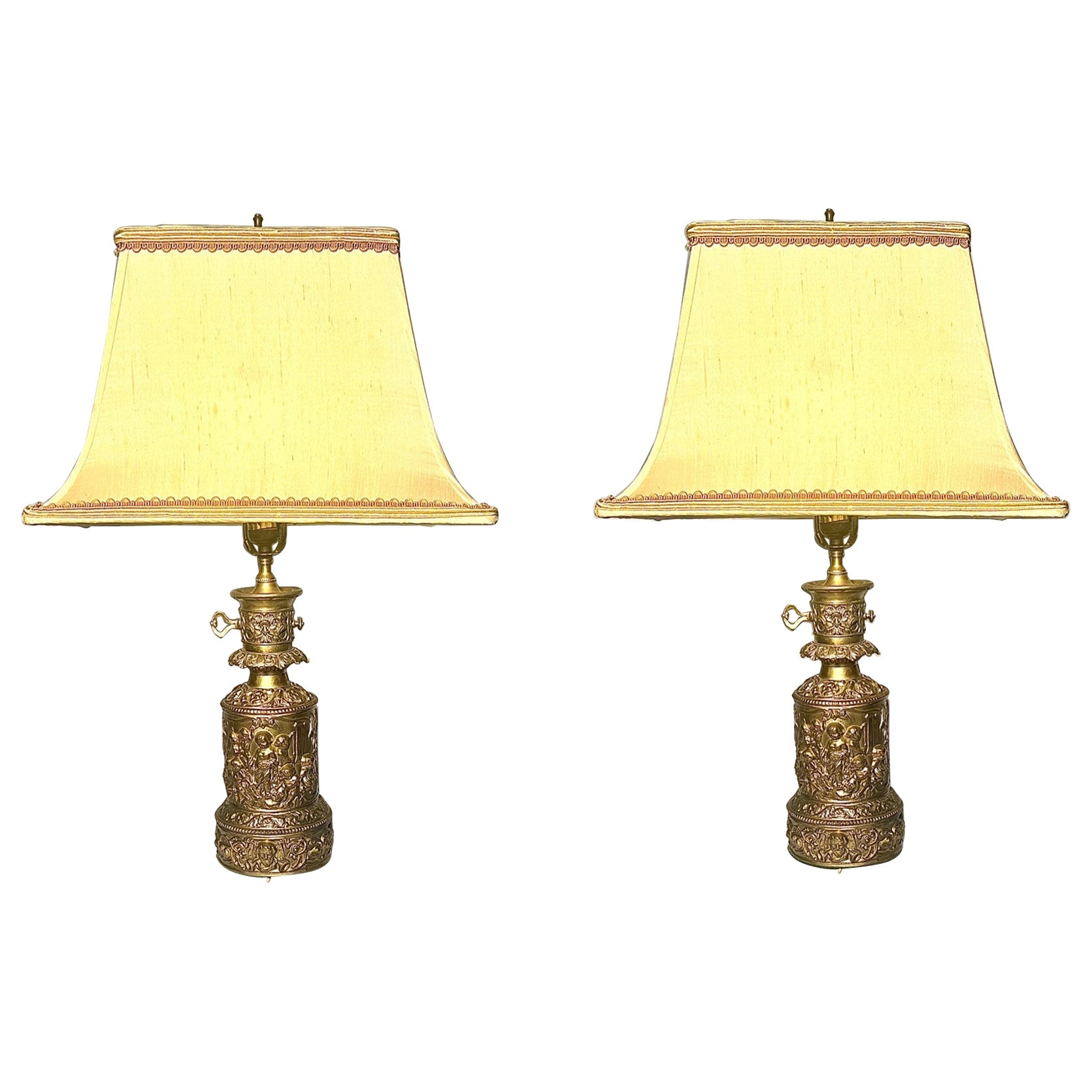 Pair of Antique French Parcel Gilt and Repousse Brass Oil Lamps, Circa 1830-1840 For Sale