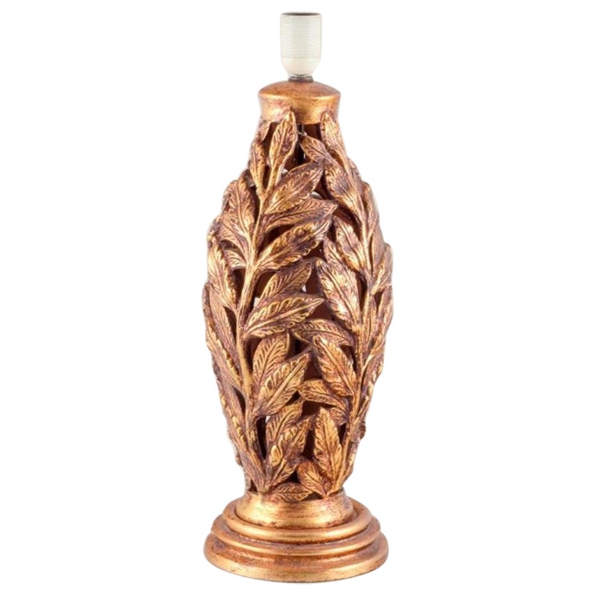 Large Italian ceramic table lamp. Shaped like branches with gold decorations. 