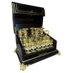 Cave à liqueur d'époque Napoléon III en poirier noirci, bronze et verre