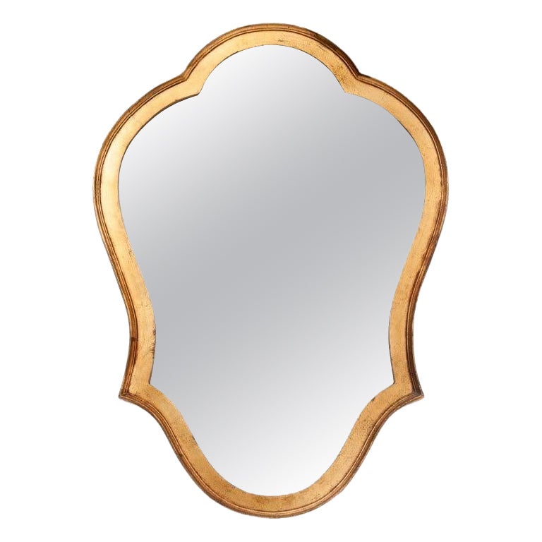 Mirror in a gold frame, France.