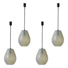 Four Seguso iridescent and corroso Murano glass pendant lamps, Italy 1950s