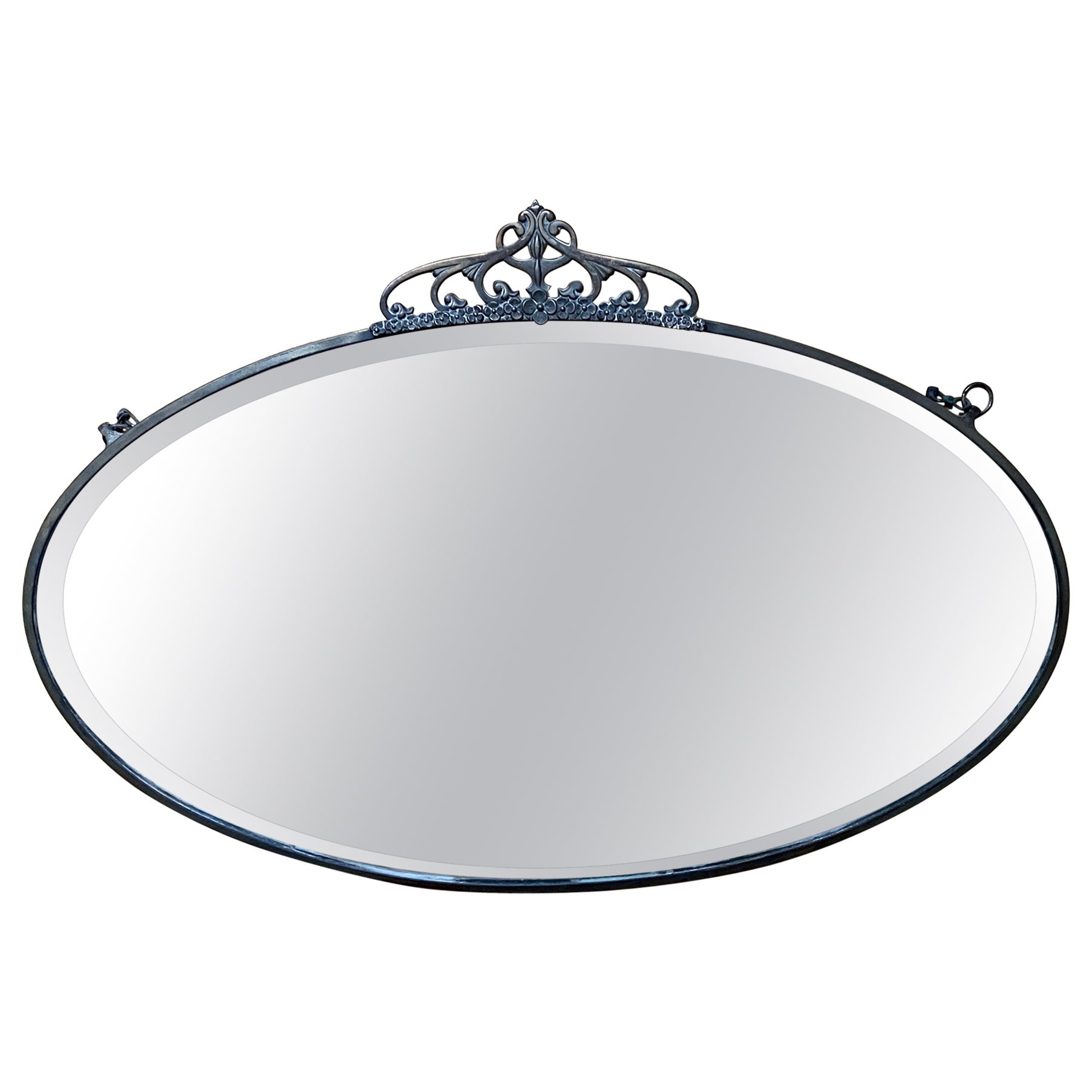 Oval antique Art Nouveau mirror with a thin brass frame and crown  For Sale