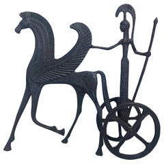 Mid century cast iron sculpture of mythical horse and figure.