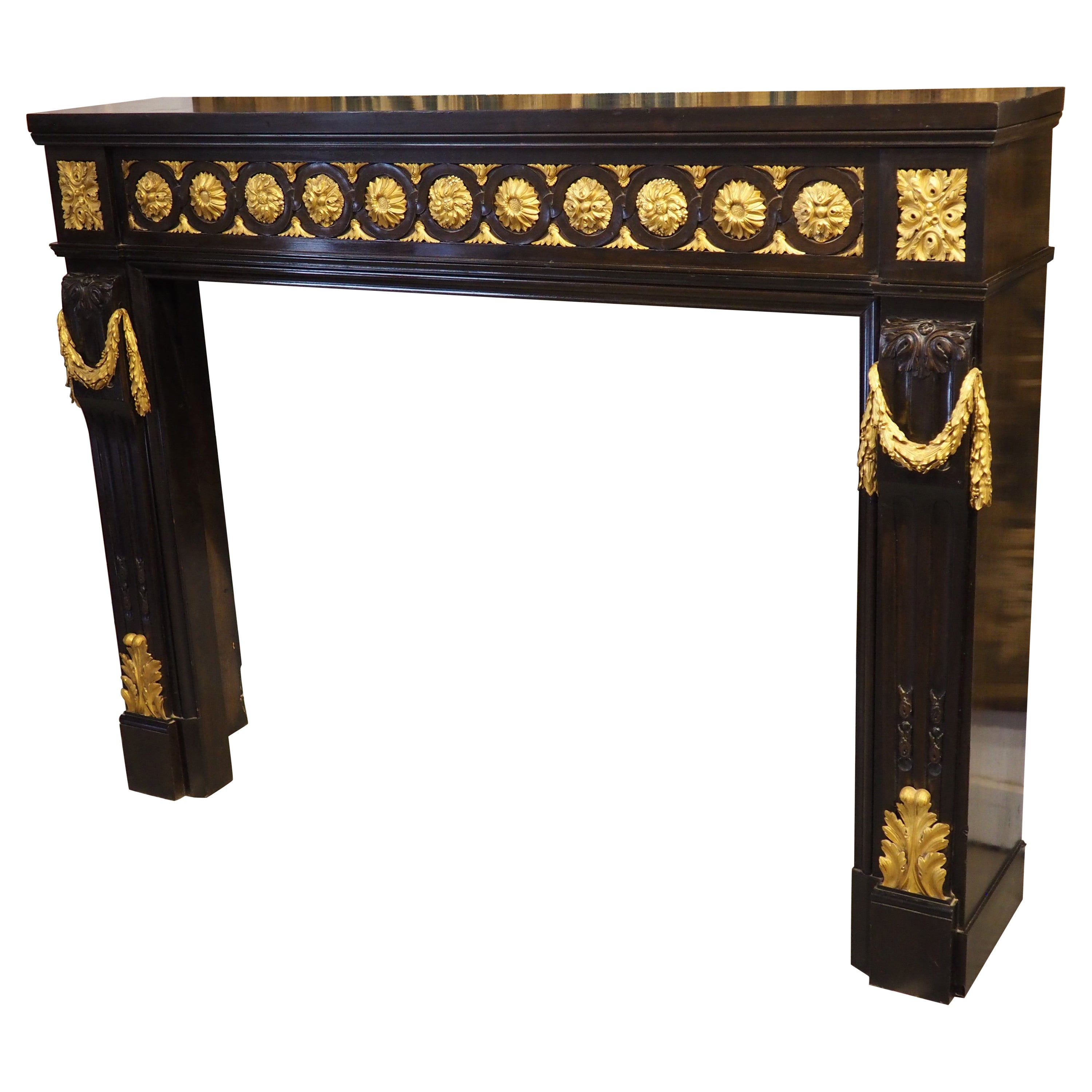 French Louis XVI Style Ebonized Wooden Mantel with Gilt Bronze Mounts, 20th C. For Sale