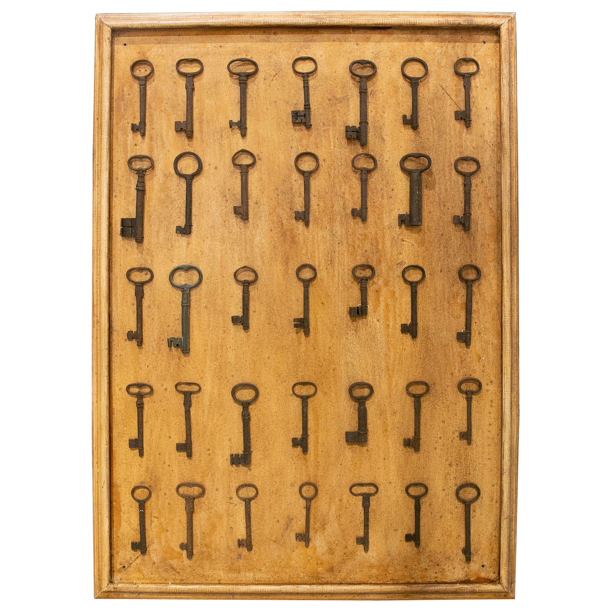 Collection of Thirty-Five Framed Antique Iron Keys  For Sale