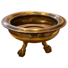 Brasero de bronce de los años 30 con patas y asas en forma de garra de león