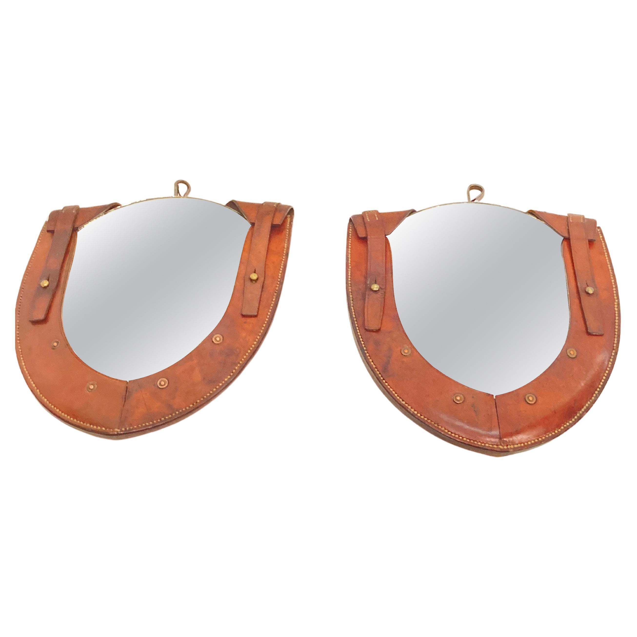 Pair of small stitched leather mirror in the style of Jacques Adnet For Sale