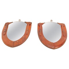 Pair of small stitched leather mirror in the style of Jacques Adnet