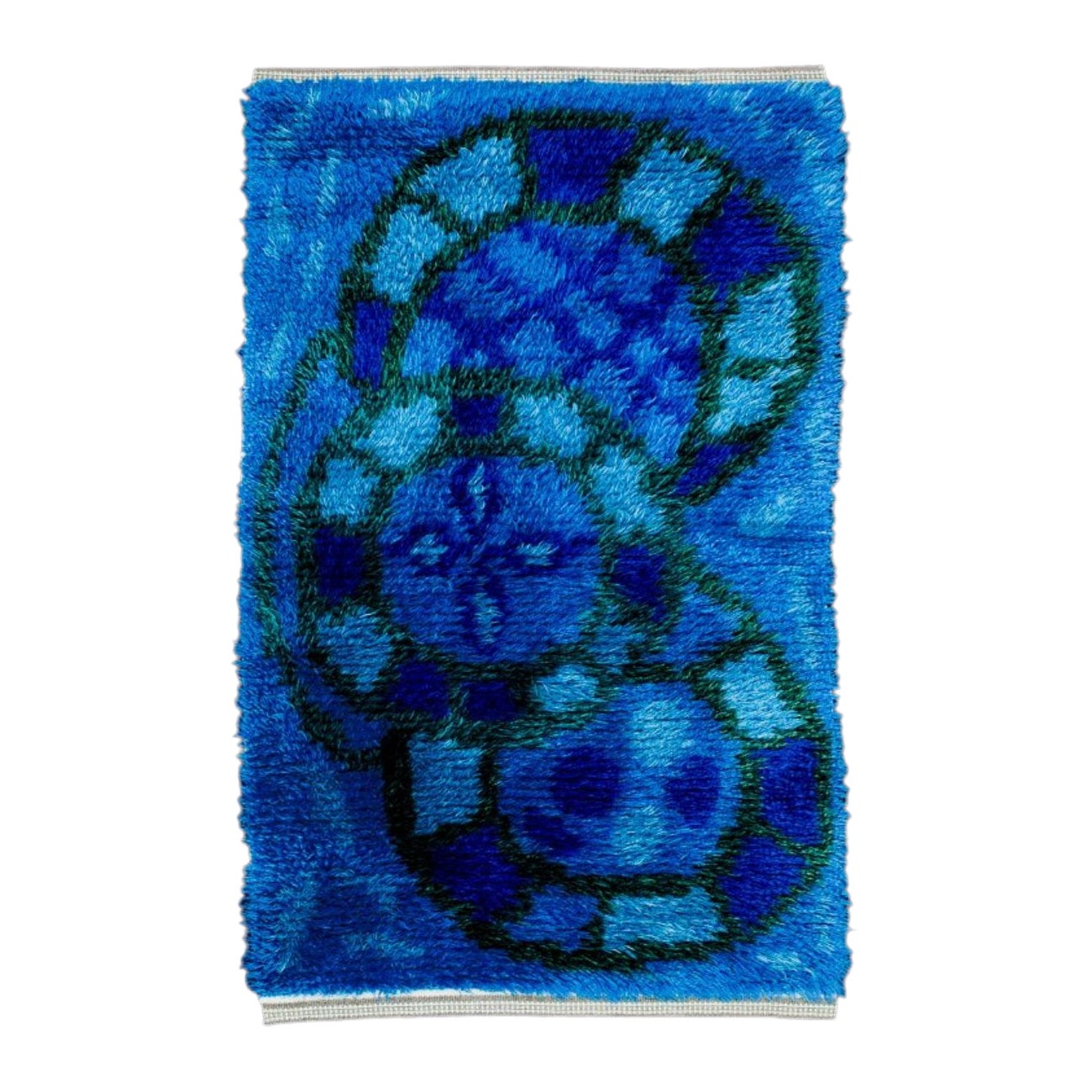 Swedish designer, handwoven rya carpet in blue, violet, and green colours.