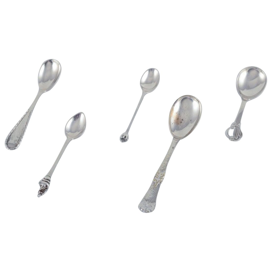 Danish silversmiths, including Heimbürger and others. Set of five spoons For Sale