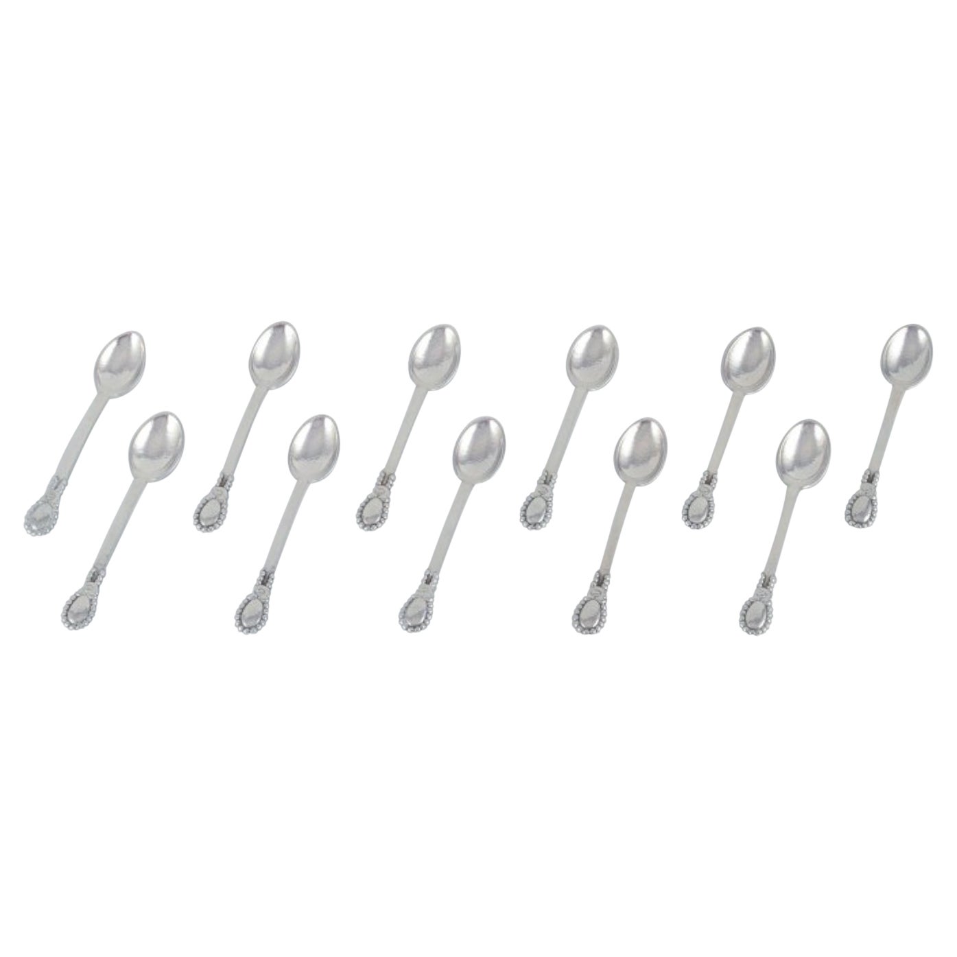 Evald Nielsen, set of eleven coffee spoons in 830 silver.  For Sale