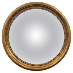 Miroir convexe encadré en bois doré du milieu du 20e siècle