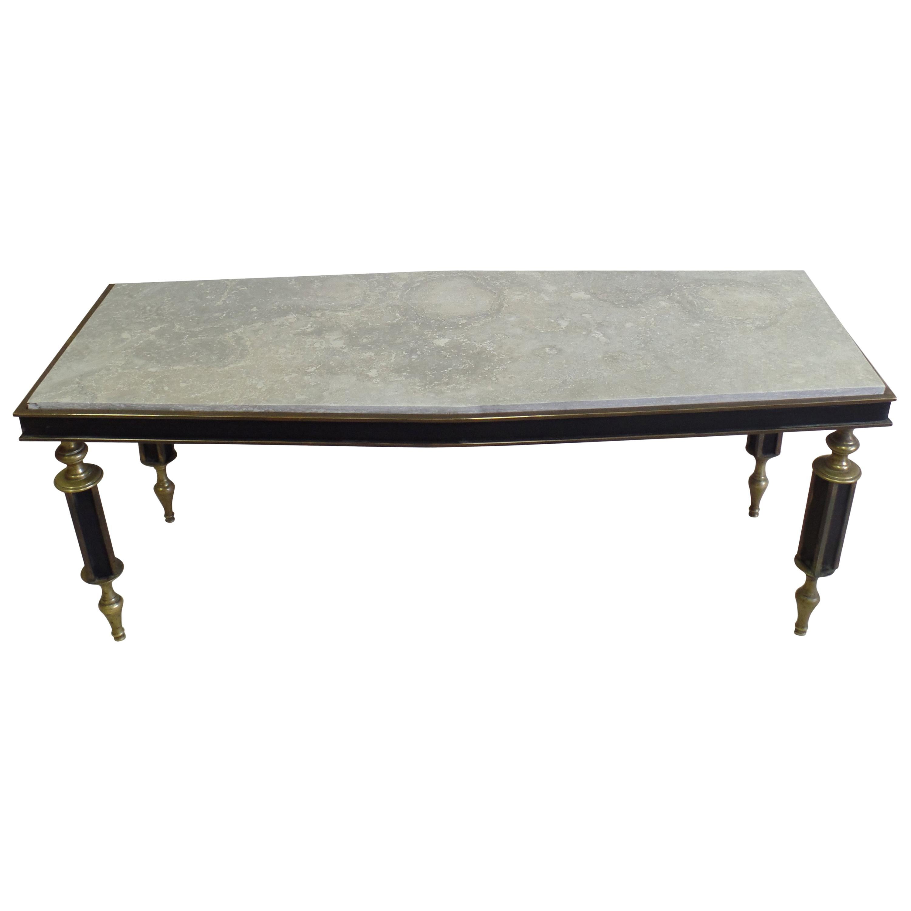 Rare, important Italian midcentury cocktail table in the modern neoclassical style attributed to Gio Ponti.

The table is set on four delicate gilt bronze and black enameled legs that dramatically alternate between turning and tapering. A silver