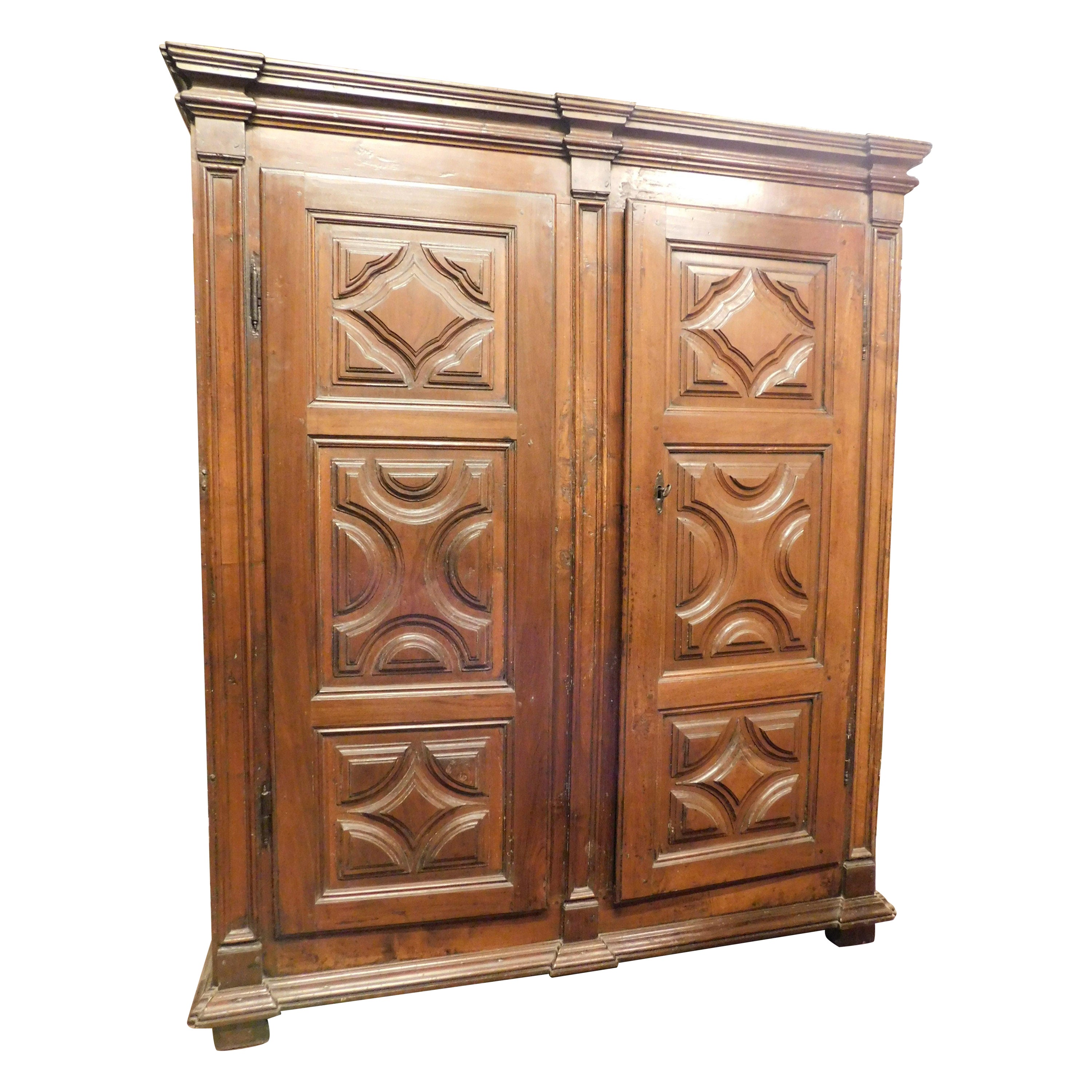 Two-door wardrobe armoires in carved walnut wood, Italy For Sale