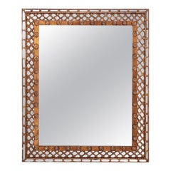 A gold mirror with lattice design circa 1950.