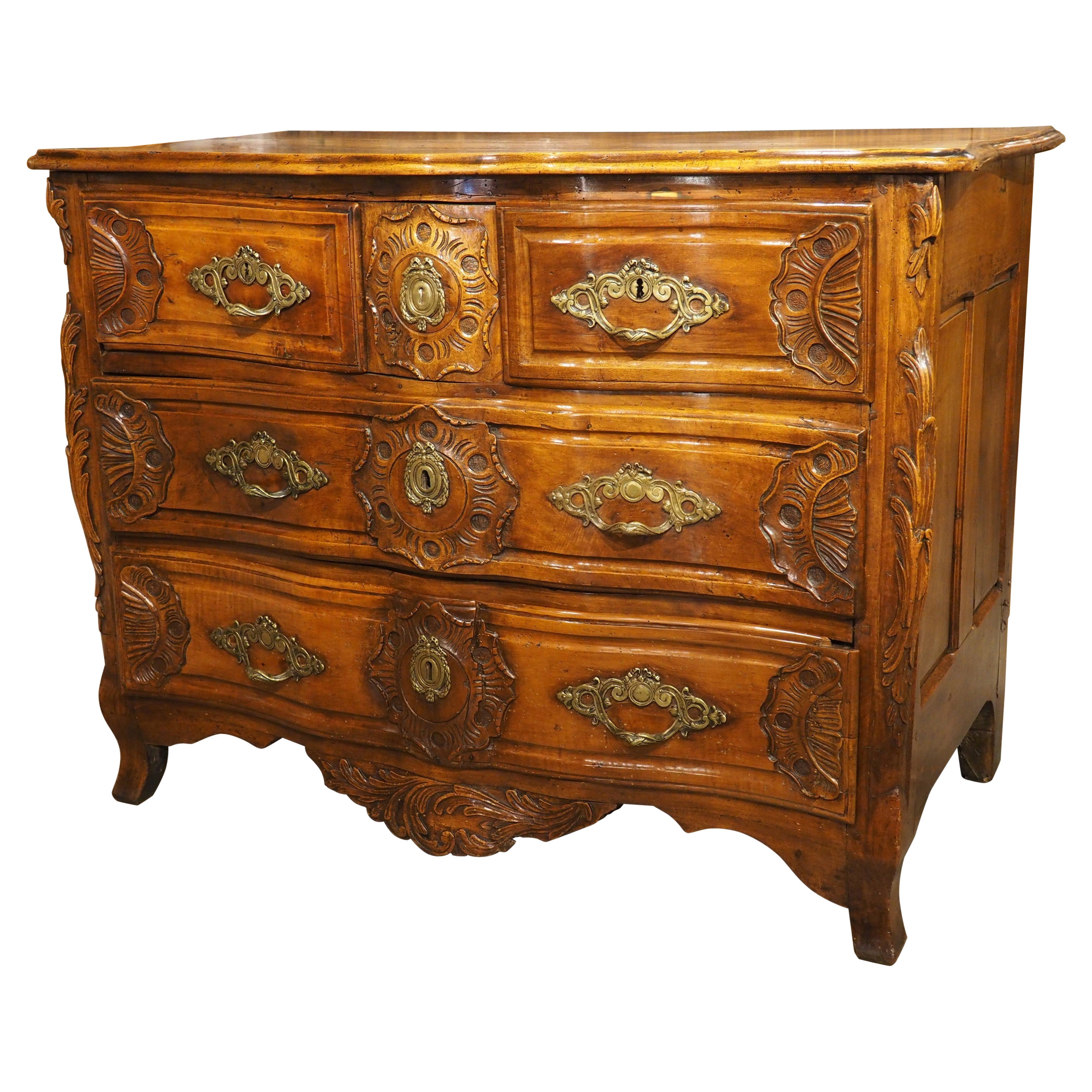 18th Century Regence Period Carved Walnut Lyonnaise Commode 'Arbalete' For Sale