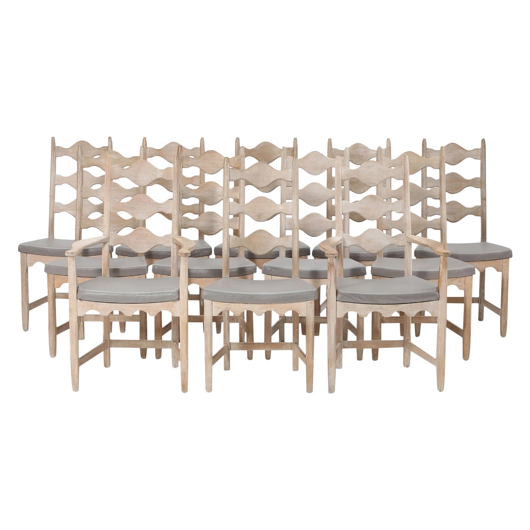 Set of Twelve Soaped Oak Highback Dining Chairs by Henning Kjaernulf