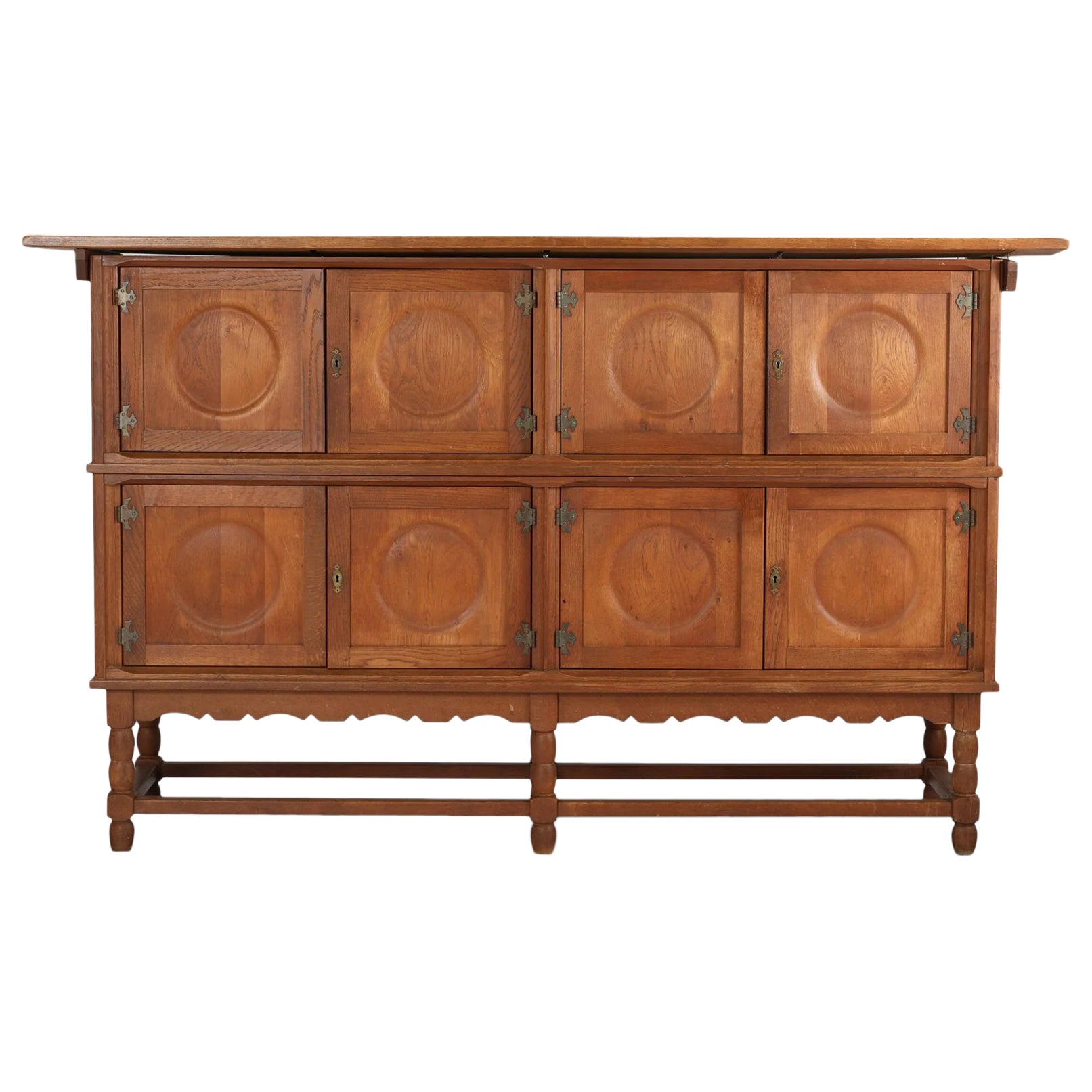 Tall oak sideboard with eight circular doors by henry kjaernulf For Sale