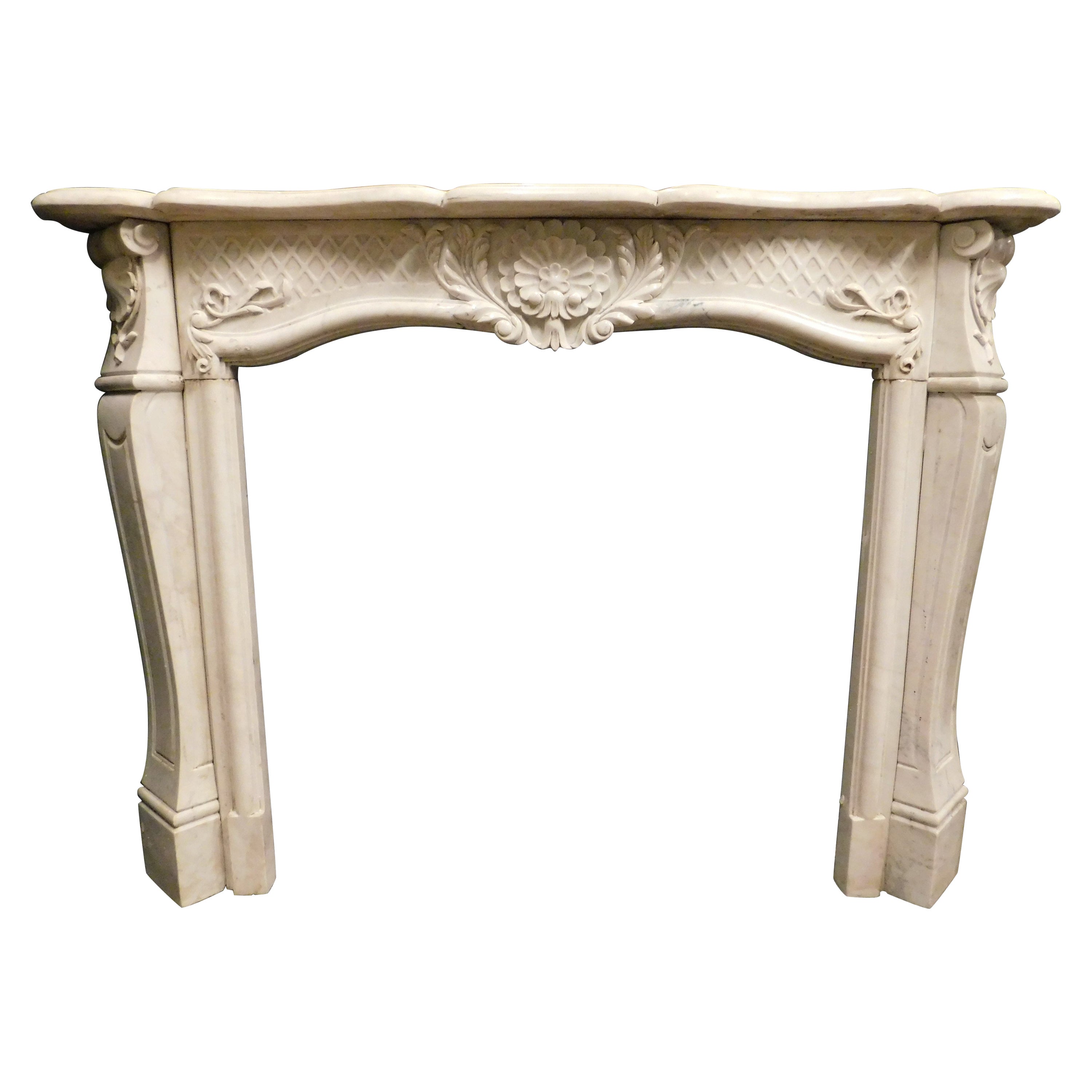 Fireplace mantle in white Carrara marble, carved with floral decorations, Italy For Sale