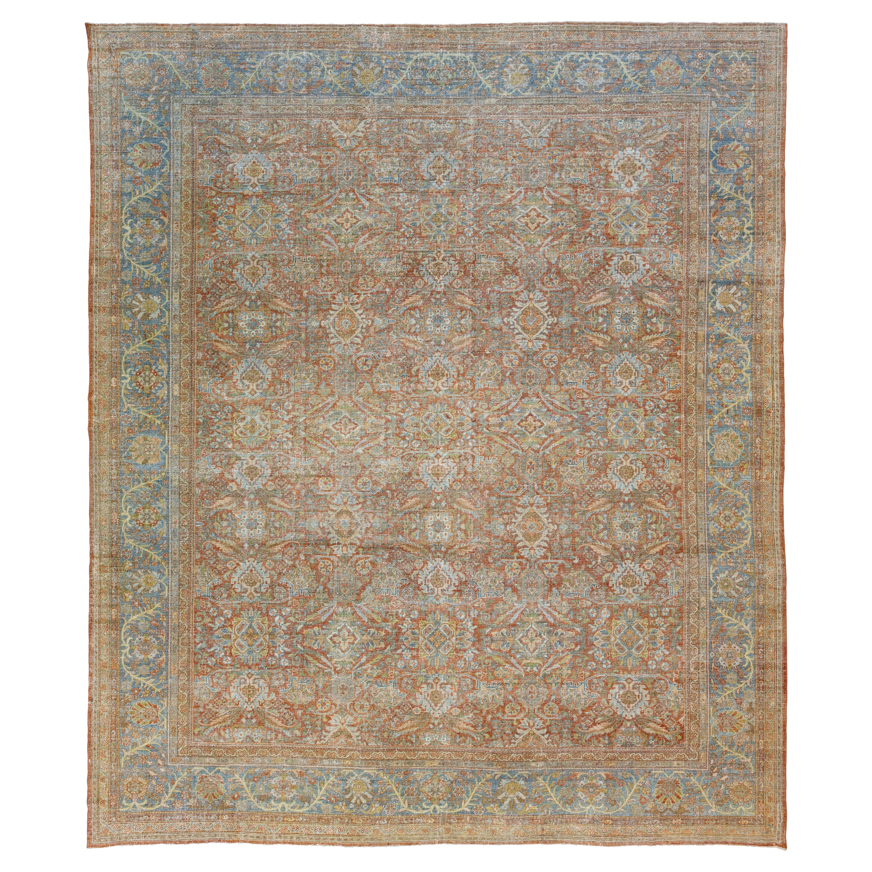 Tapis persan Mahal ancien des années 1900, en laine rouille avec motif floral sur toute la surface