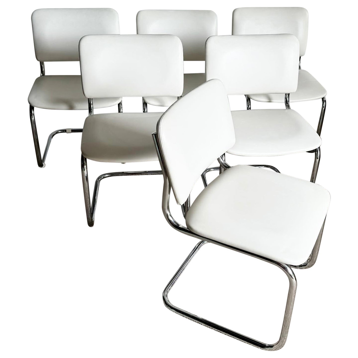 Mid Century White Vinyl and Chrome Cantilever Dining Chairs by Loewenstein/Oggo