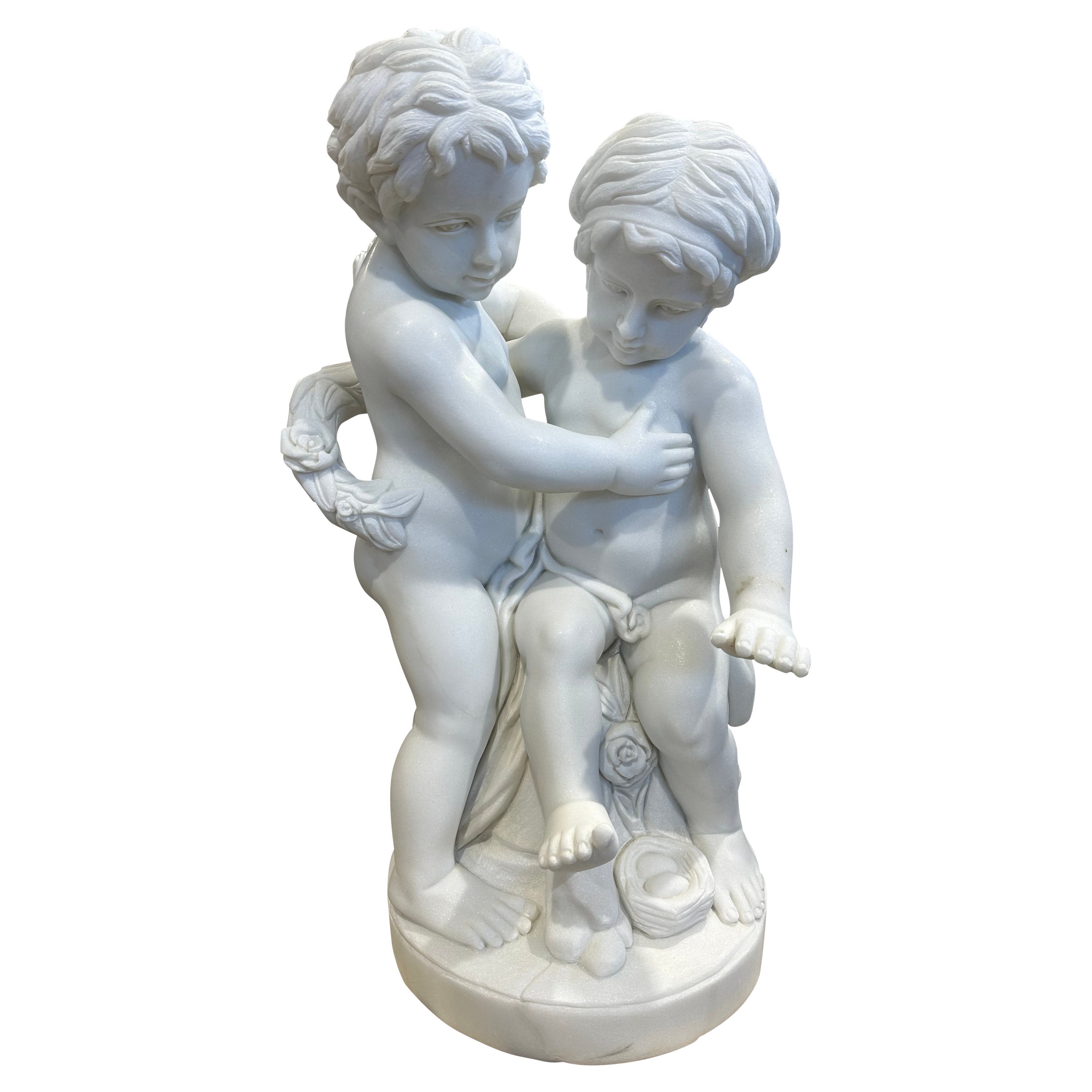 Magnifique sculpture de deux putti en marbre