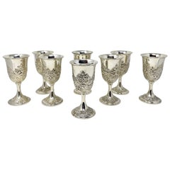 Set of 8 Antique American "Kirk" Repousse Sterling Silver Goblets, Circa 1900's.