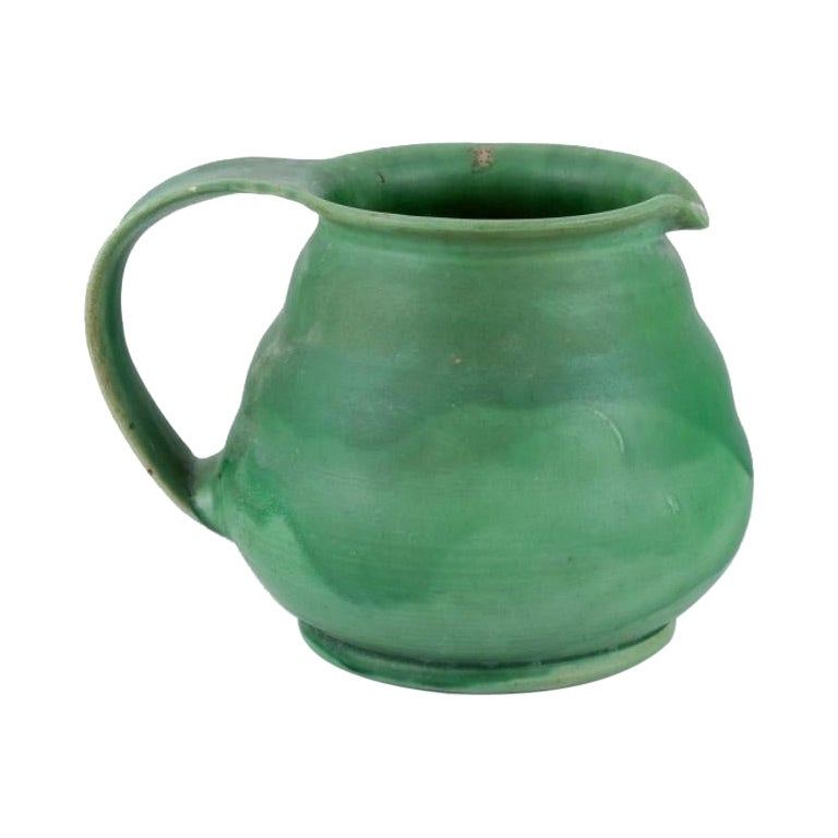 Kähler, Denmark. Ceramic pitcher. Glaze in green tones. Approx. 1930/40s. For Sale