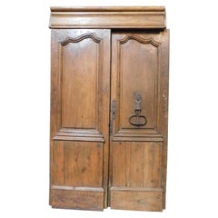 Used Double wing entrance main old door, carved in walnut wood with beam, Italy