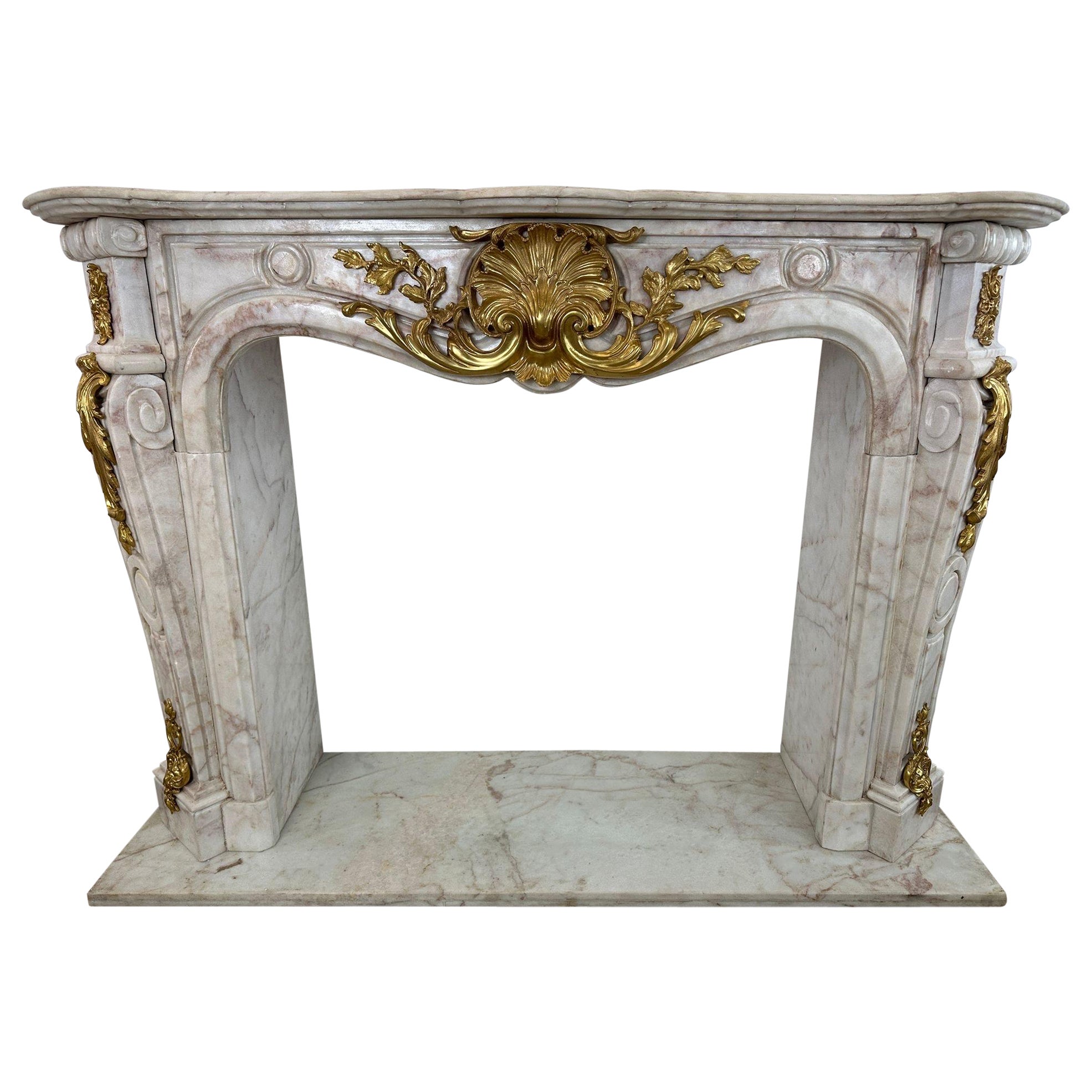 Fantastic, French marble rococo fireplace with bronze ormolu  For Sale