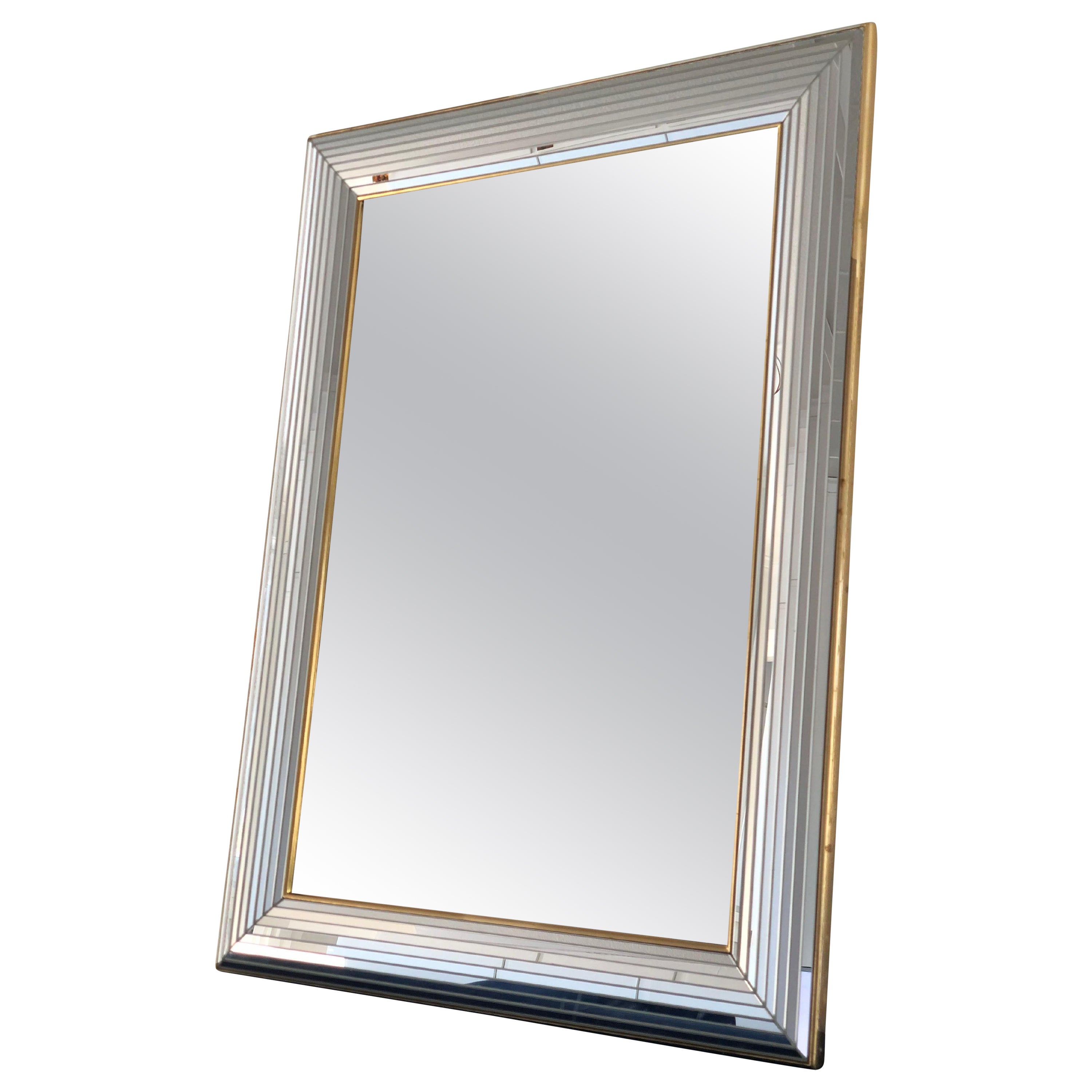 Beautiful Belgium mirror with a glass frame with a golden strip. The frame is made with small facet cut mirrors in the full width.

Handmade mirror In good condition. Belgium, 1980

Object: Mirror
Designer: Deknudt
Mark: A sticker on the back with