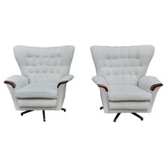 A pair Vintage 1960s G plan swivel armchairs