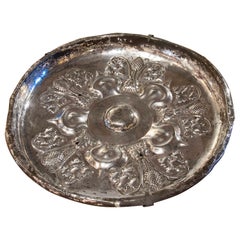 19th Century Silvered Metal Plate with Flower and Face Decoration