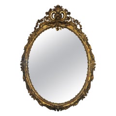 Monumentale specchio ovale europeo in legno dorato e gesso, fine XIX-inizio XX secolo