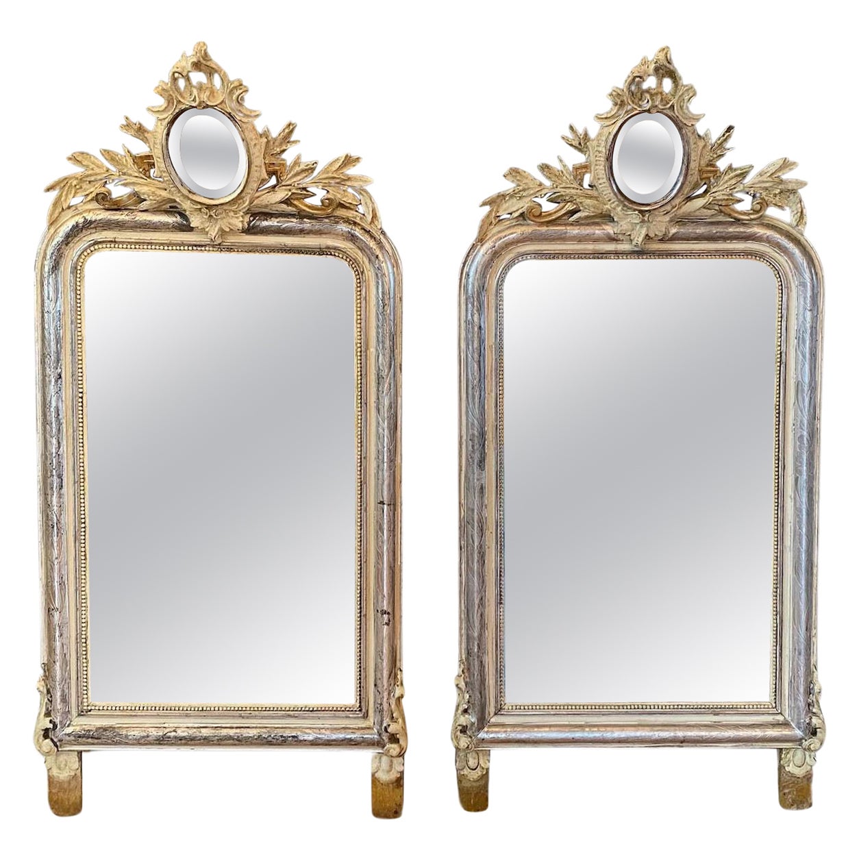 A pair of 19th century French gilt and carved mirrors For Sale
