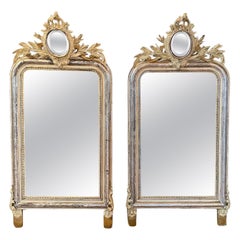 Antique A pair of 19th century French gilt and carved mirrors